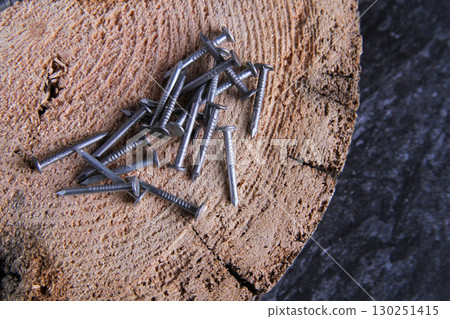 Fasteners for wood. Self-tapping screws on a wooden table. 130251415