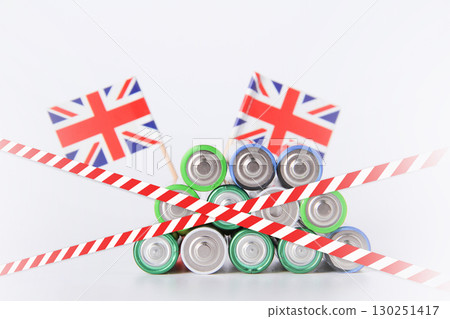 Battery. A lot of batteries on the background of the flag of the country. Battery. A lot of batteries on the background of the flag of the country. 130251417