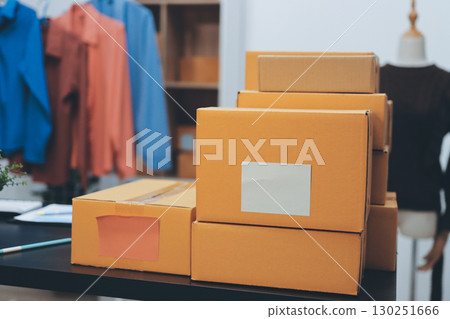 Portrait of Starting small businesses SME owners, two Asian woman check online orders Selling products working with boxs freelance work at home office, sme business online small medium enterprise 130251666