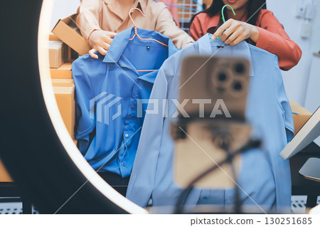 Portrait of Starting small businesses SME owners, two Asian woman check online orders Selling products working with boxs freelance work at home office, sme business online small medium enterprise Portrait of Starting small businesses SME owners, two Asian woman check online orders Selling products working with boxs freelance work at home office, sme business online small medium enterprise 130251685