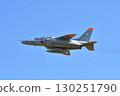 T-4 trainer flying in the blue sky 130251790