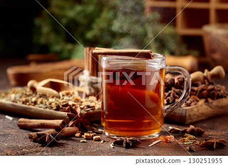 Christmas herbal tea with cinnamon, anise, and dried herbs. 130251955