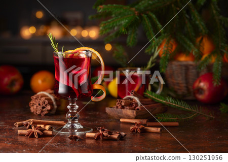 Christmas mulled wine with citrus, apples, cinnamon, anise, and rosemary. 130251956