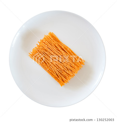 dried fish straws on plate, top view, isolated on white background with clipping path 130252003