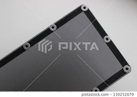 Pattern of protective grill with small round holes and mounting bracket on the frame isolated on white Pattern of protective grill with small round holes and mounting bracket on the frame isolated on white 130252070