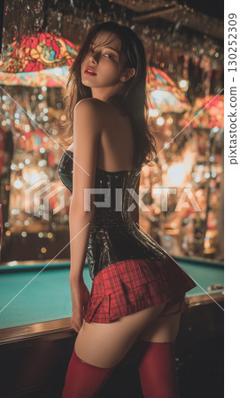 Model poses elegantly in a stylish outfit at an upscale venue with vibrant decor and soft lighting 130252309