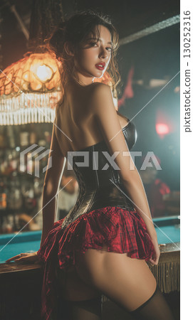 Model posing in a vintage bar with intricate decor in a dramatic evening setting 130252316