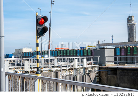 A traffic light in seaport in Ostend, Belgien. Red light signal for boats and ships. A traffic light in seaport in Ostend, Belgien. Red light signal for boats and ships. 130252615
