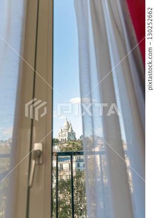 Balcony door with city view and white curtains 130252662
