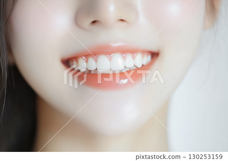 Beautiful white teeth and mouth of a young woman (cosmetics, skin care, health, beauty, cosmetics) 130253159
