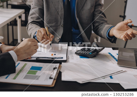 Accounting company provide finance and taxation planning for profitable cash flow, Auditor and accountant team working in office, analyze financial data and accounting record with calculator.Insight 130253286