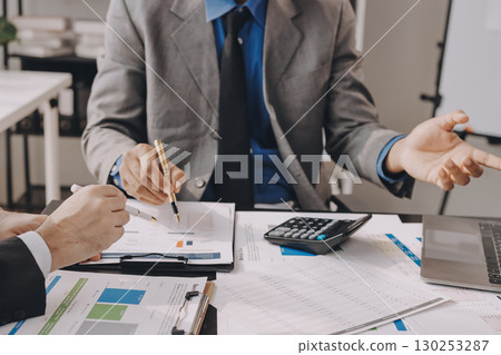 Accounting company provide finance and taxation planning for profitable cash flow, Auditor and accountant team working in office, analyze financial data and accounting record with calculator.Insight 130253287