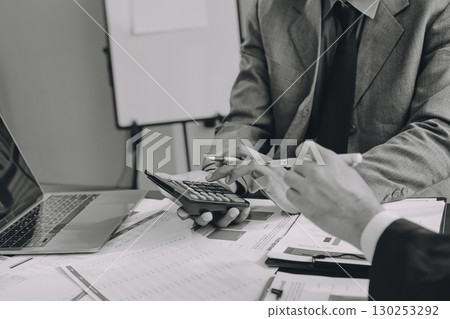 Accounting company provide finance and taxation planning for profitable cash flow, Auditor and accountant team working in office, analyze financial data and accounting record with calculator.Insight Accounting company provide finance and taxation planning for profitable cash flow, Auditor and accountant team working in office, analyze financial data and accounting record with calculator.Insight 130253292