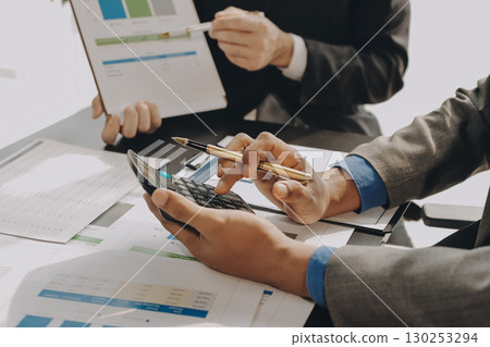 Accounting company provide finance and taxation planning for profitable cash flow, Auditor and accountant team working in office, analyze financial data and accounting record with calculator.Insight 130253294