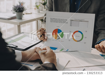 Accounting company provide finance and taxation planning for profitable cash flow, Auditor and accountant team working in office, analyze financial data and accounting record with calculator.Insight 130253313