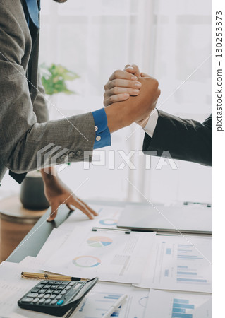 Business handshake for teamwork of business merger and acquisition,successful negotiate,hand shake,two businessman shake hand with partner to celebration partnership and business deal concept Business handshake for teamwork of business merger and acquisition,successful negotiate,hand shake,two businessman shake hand with partner to celebration partnership and business deal concept 130253373