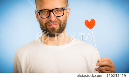 Adult man with heart on stick 130253459