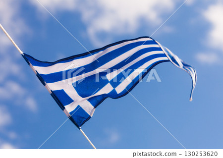 Greek flag waving against blue sky 130253620