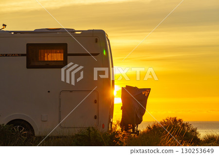 Caravan on nature in the morning at sunrise Caravan on nature in the morning at sunrise 130253649