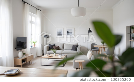 Modern Minimalist Living Room with Bright Natural Light and Elegant Decor Elements 130255260