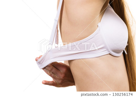 Woman wearing too big bra Woman wearing too big bra 130256174