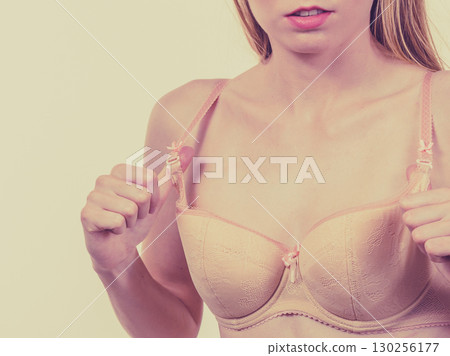 Woman wearing wrong size bra 130256177