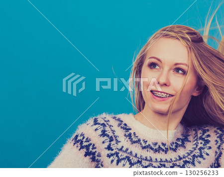 Crazy blonde woman with windblown blonde hair 130256233