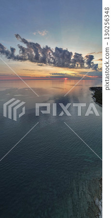 Sunset clouds over the Adriatic coast vertical panorama. Istria, Croatia. 130256348