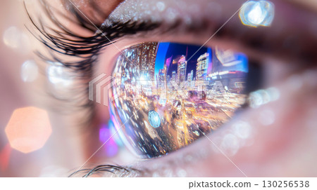 Closeup human eye reflecting night neon lights cityscape 130256538