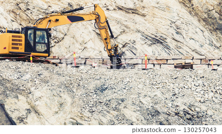 Heavy machine working on construction site, Norway Heavy machine working on construction site, Norway 130257043