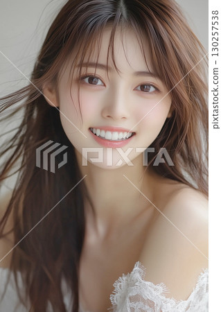Smiling young woman's facial expression 130257538