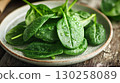 Green spinach leaves close up with dew drops healthy organic food 130258089