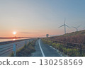 Sunset, windmills and country road 130258569