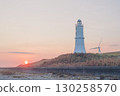 Lighthouse, windmill and sunset 130258570