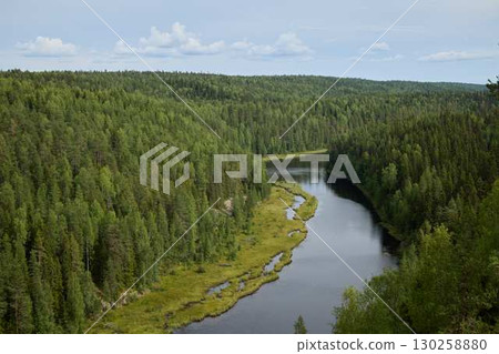 Beautiful Lush Forest Landscape Featuring a Serene Meandering River in a Remote Area Beautiful Lush Forest Landscape Featuring a Serene Meandering River in a Remote Area 130258880
