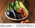 Fresh summer vegetables in a basket 130259011