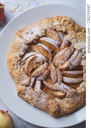 Diet apple galette with oatmeal. Vegan dessert recipe. 130259367