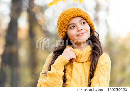 dreaming kid in autumn style with happy smile, childhood 130259660