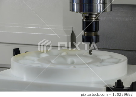 The CNC milling machine finish cut the plastic parts by solid ball nose end mill tool. The CNC milling machine finish cut the plastic parts by solid ball nose end mill tool. 130259692