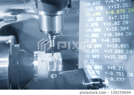 Abstract 5-axis CNC milling machine cutting the automotive part and G-code data background in the light blue scene. Abstract 5-axis CNC milling machine cutting the automotive part and G-code data background in the light blue scene. 130259694