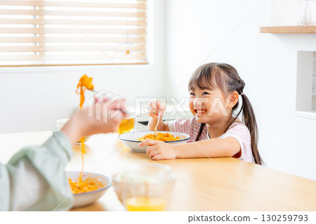Pasta lunch parent and child 130259793