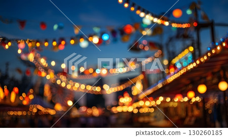 Evening Oktoberfest scene with colorful carnival lights, 130260185