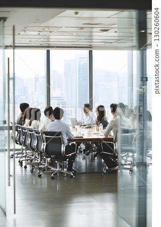 Asian corporate team collaborating in modern conference room Asian corporate team collaborating in modern conference room 130260604