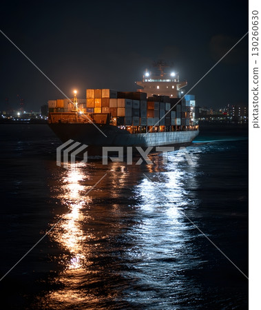 container ship night departure scene 130260630