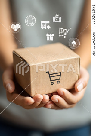 hands holding parcel with shipping icons overlay 130261651