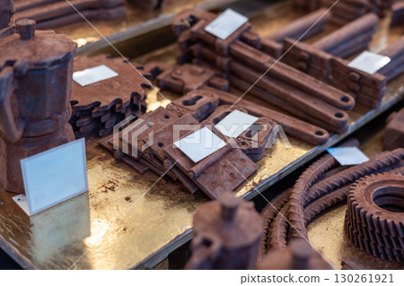 Chocolate tools and utensils displayed on golden tray Chocolate tools and utensils displayed on golden tray 130261921