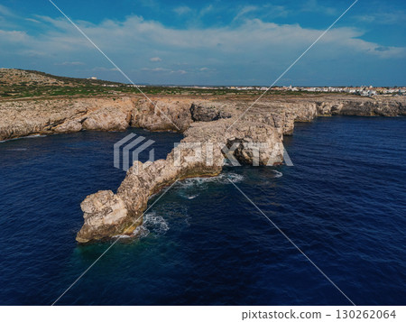 Natural rock arch extending Natural rock arch extending 130262064