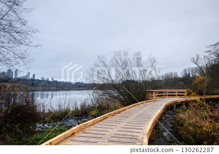 Elevated wooden walkay in Burnaby Deer Lake Park, BC, Canada Elevated wooden walkay in Burnaby Deer Lake Park, BC, Canada 130262287