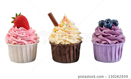 Three colorful cupcakes with strawberry, cream and blueberry toppings isolated on white background, sweet dessert trio concept 130262939