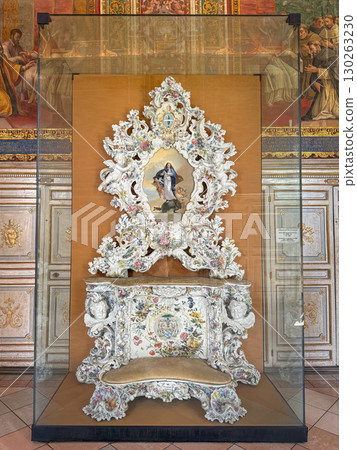 VATICAN CITY, ROME, ITALY - AUGUST 02, 2025 Altar for Leon XIII as rococo white porcelain throne with a religious painting of the Madonna and Child. Delicate artistry adorned with colorful flowers 130263230
